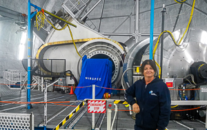 Dr. Smith on the bridge inside the Keck II dome, with NIRSPEC in the background.