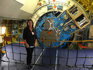 Dr. Smith inside SOFIA, showing the part of the telescope that extends into the main cabin.